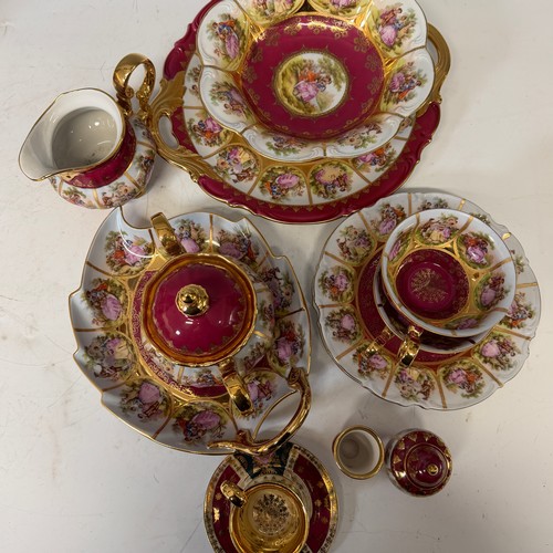 187 - A quantity Faronard-style burgundy red Vienna Porcelain, made by Josef Kuba, including part coffee a... 