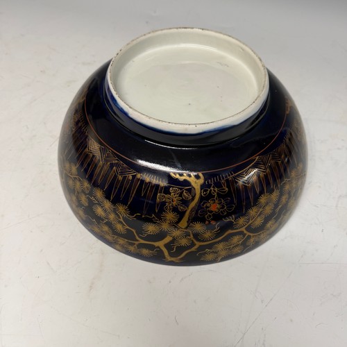 216 - A 19th century blue and gilt porcelain Bowl, decorated with floral motifs, H 13 cm x diameter 31.5 c... 
