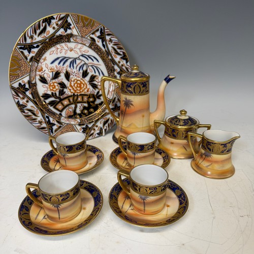 185 - A Noritake eleven-piece 'desert scene' tea Service, comprising of a teapot, milk jug, sucrier, four ... 