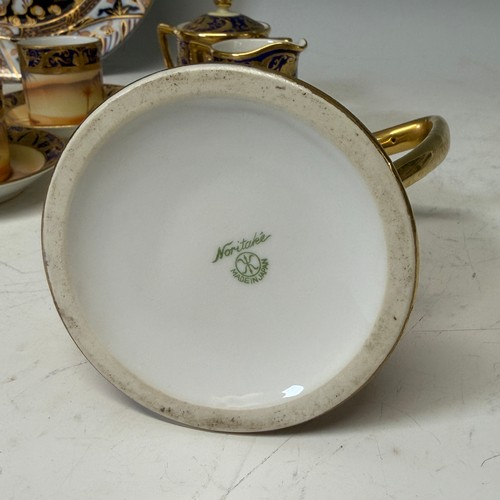 185 - A Noritake eleven-piece 'desert scene' tea Service, comprising of a teapot, milk jug, sucrier, four ... 