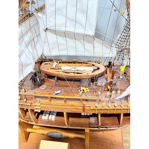 165 - A scratch-built model of the H.M.S Bounty, built by H.J Brabham, 2000, housed in an oak glazed Case,... 