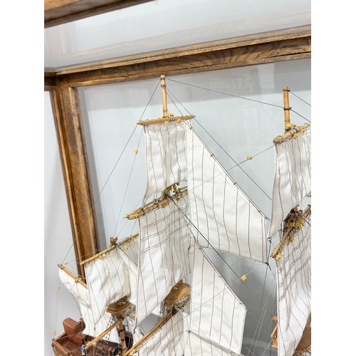 165 - A scratch-built model of the H.M.S Bounty, built by H.J Brabham, 2000, housed in an oak glazed Case,... 