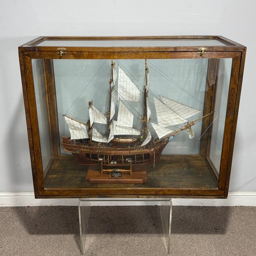 165 - A scratch-built model of the H.M.S Bounty, built by H.J Brabham, 2000, housed in an oak glazed Case,... 