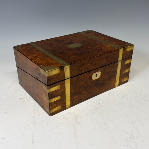 302 - A 19th century burr walnut and brass bound writing Slope, complete with fitted interior and black le... 