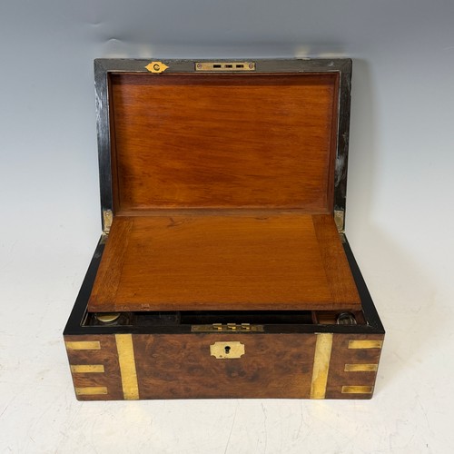 302 - A 19th century burr walnut and brass bound writing Slope, complete with fitted interior and black le... 