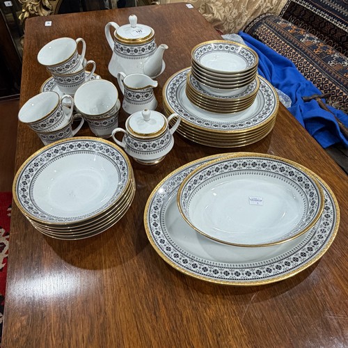 195 - A Noritake Scheherazade part Dinner and Tea Service, decorated in transfer printed black and gold pa... 