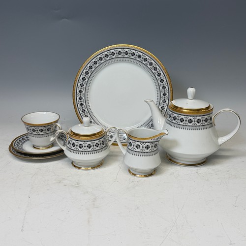 195 - A Noritake Scheherazade part Dinner and Tea Service, decorated in transfer printed black and gold pa... 