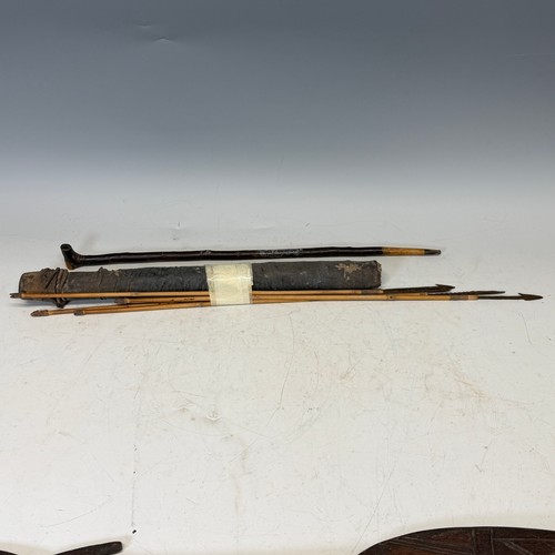286 - Tribal Artefacts; a pair of carved wooden spears/paddles, some losses to carving, together with a qu... 