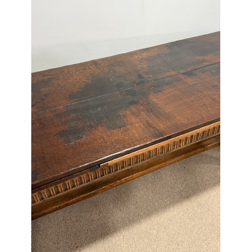 116 - A 17th century style oak extending refectory dining Table, the turned supports united by a 'H' stret... 