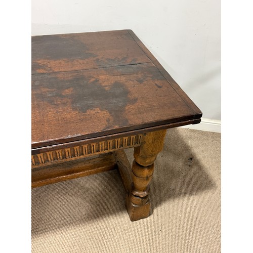 116 - A 17th century style oak extending refectory dining Table, the turned supports united by a 'H' stret... 