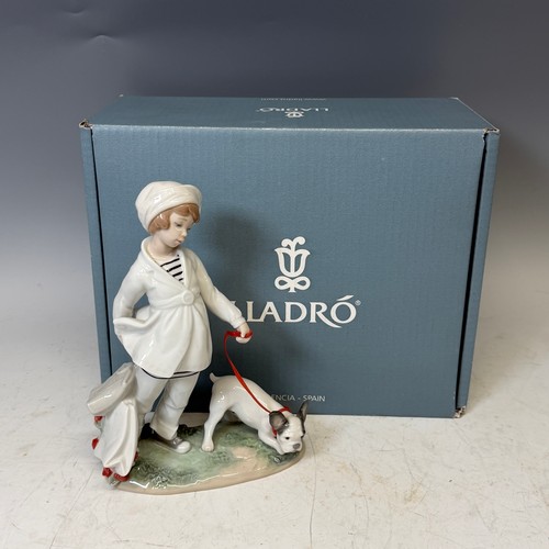 231 - A Lladro figure 'Girl with French bulldog', with original box, certificate, and receipt of purchase,... 