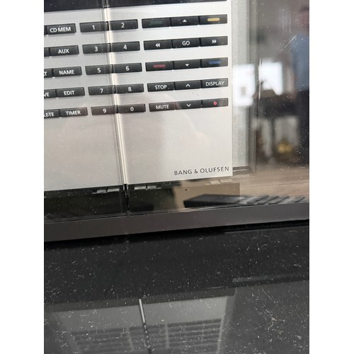 217 - A Bang & Olufsen Beosound 3200, W 31 cm x H 37 cm x D 12 cm, with a small black Cabinet and a qu... 