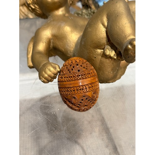 267 - A carved coquilla nut pocket pomander, together with brass candlesticks and easels, glass chandelier... 