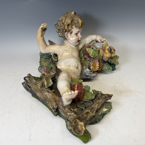 272 - A large 19th century Maiolica figure of a Putto, centrepiece converted to a wall hanging, probably I... 