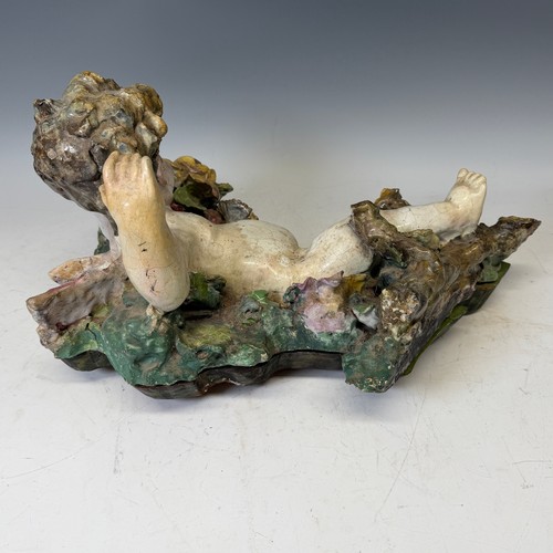 272 - A large 19th century Maiolica figure of a Putto, centrepiece converted to a wall hanging, probably I... 