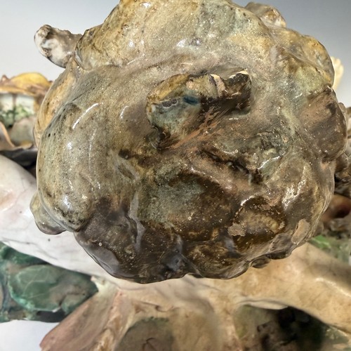272 - A large 19th century Maiolica figure of a Putto, centrepiece converted to a wall hanging, probably I... 