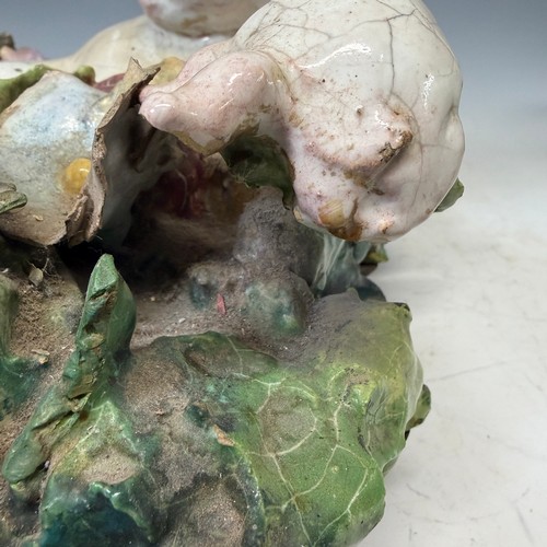 272 - A large 19th century Maiolica figure of a Putto, centrepiece converted to a wall hanging, probably I... 