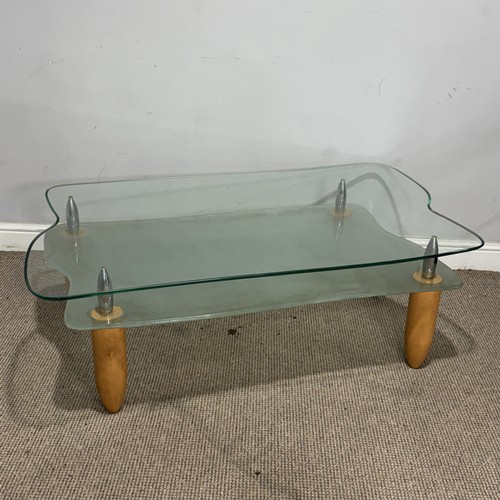 172 - A contemporary retro-style glass coffee Table, with frosted under-tier, raised upon tapered supports... 