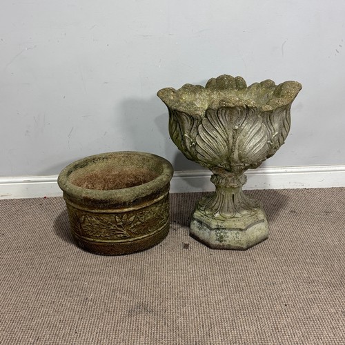179 - A weathered reconstituted stone garden Urn, with acanthus/cabbage leaf bowl, raised on an octagonal ... 