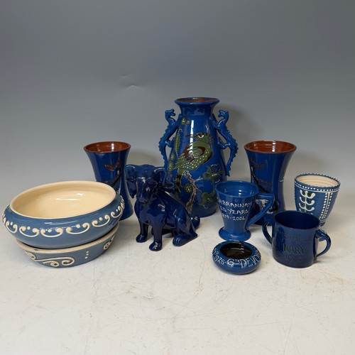 254 - A C. H. Brannam glazed figure of a Dog, modelled with collar, impressed signature to base, H 18cm, w... 