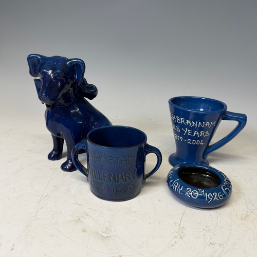 254 - A C. H. Brannam glazed figure of a Dog, modelled with collar, impressed signature to base, H 18cm, w... 