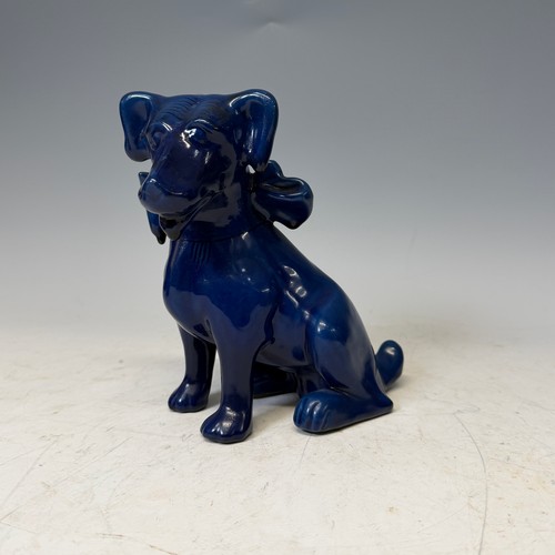 254 - A C. H. Brannam glazed figure of a Dog, modelled with collar, impressed signature to base, H 18cm, w... 