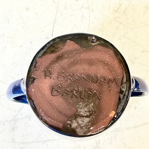 254 - A C. H. Brannam glazed figure of a Dog, modelled with collar, impressed signature to base, H 18cm, w... 