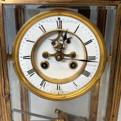 91 - An early 20th century French four-glass gilt metal mantel Clock, the dial with skeleton escapement a... 