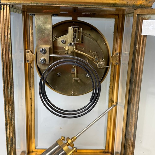91 - An early 20th century French four-glass gilt metal mantel Clock, the dial with skeleton escapement a... 