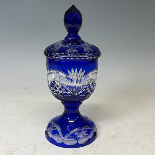 186 - A Bavarian blue flashed and cut glass Vase and Cover, of goblet form, H 27.5 cm, together with two d... 