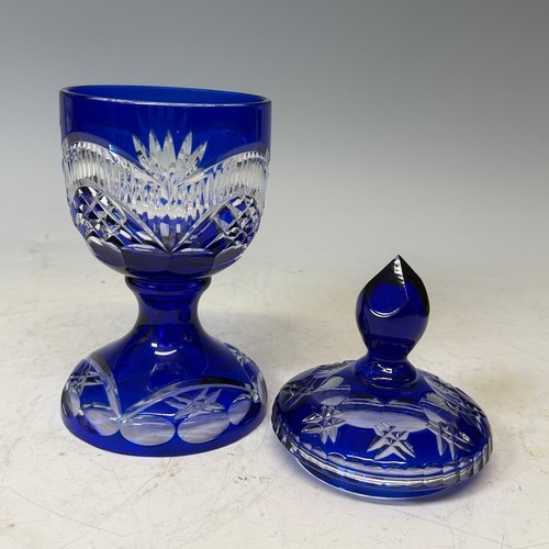 186 - A Bavarian blue flashed and cut glass Vase and Cover, of goblet form, H 27.5 cm, together with two d... 