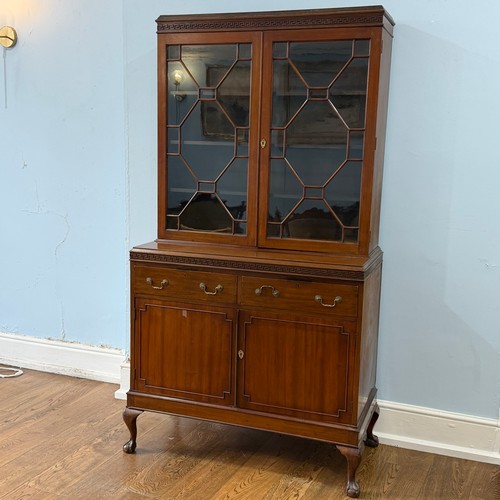 253 - A 20th century Chinese hardwood display Cabinet/Bookcase, the moulded cornice above astragal glazed ... 