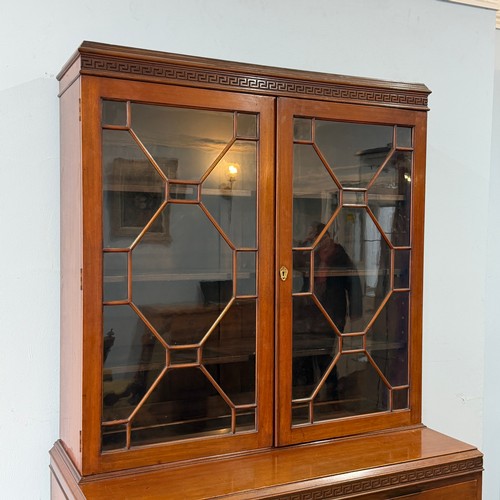 253 - A 20th century Chinese hardwood display Cabinet/Bookcase, the moulded cornice above astragal glazed ... 