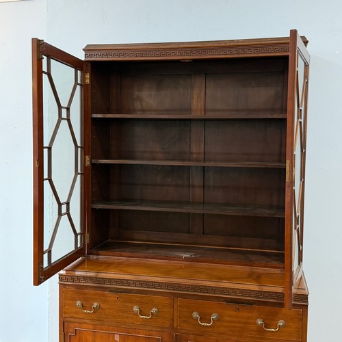 253 - A 20th century Chinese hardwood display Cabinet/Bookcase, the moulded cornice above astragal glazed ... 
