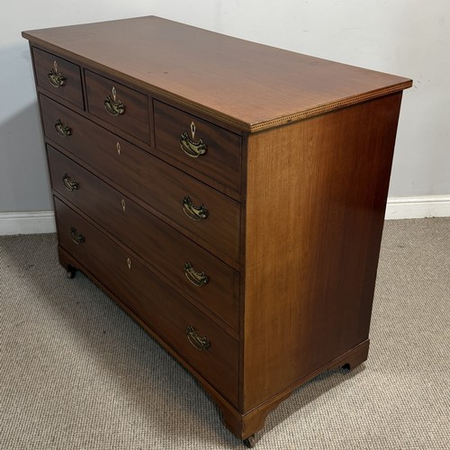 62 - An Edwardian mahogany Chest of Drawers, the top with geometric marquetry banding, applied with ivory... 
