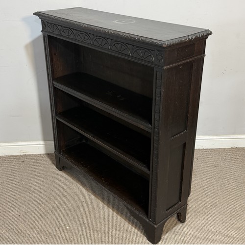 64 - An antique Victorian style carved oak open Bookcase, raised upon short tapering supports, W 107 cm x... 