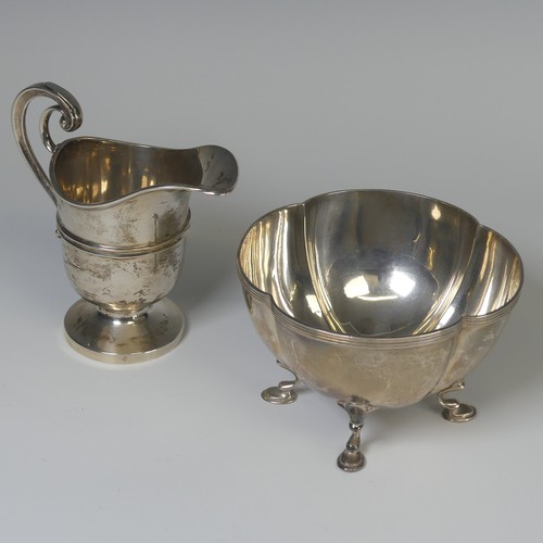 7 - An Edwardian silver Cream Jug, by James Deakin & Sons, hallmarked Sheffield, 1906, of helmet for... 