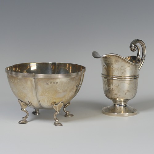 7 - An Edwardian silver Cream Jug, by James Deakin & Sons, hallmarked Sheffield, 1906, of helmet for... 