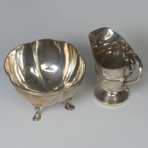 7 - An Edwardian silver Cream Jug, by James Deakin & Sons, hallmarked Sheffield, 1906, of helmet for... 