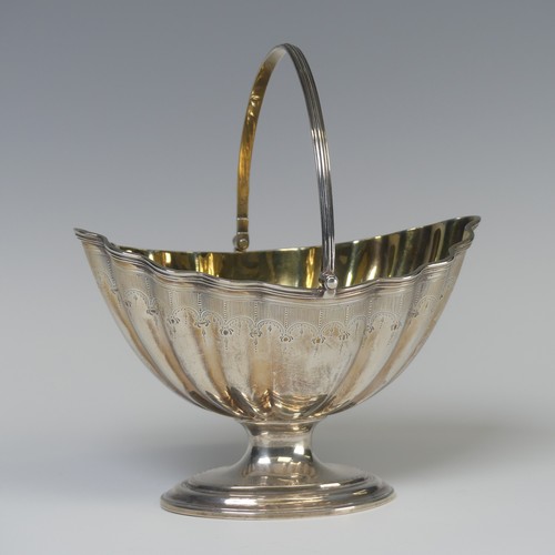 5 - A George III silver swing handled Sugar Basket, later hallmarked London 1946, gilt interior, 16.5cm ... 