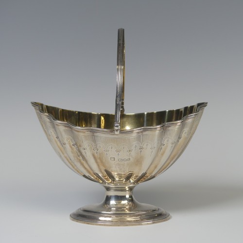 5 - A George III silver swing handled Sugar Basket, later hallmarked London 1946, gilt interior, 16.5cm ... 