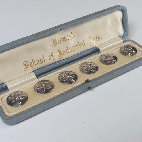 38 - A set of six Arts & Crafts silver Buttons, each circular button cast in low relief with a flower... 