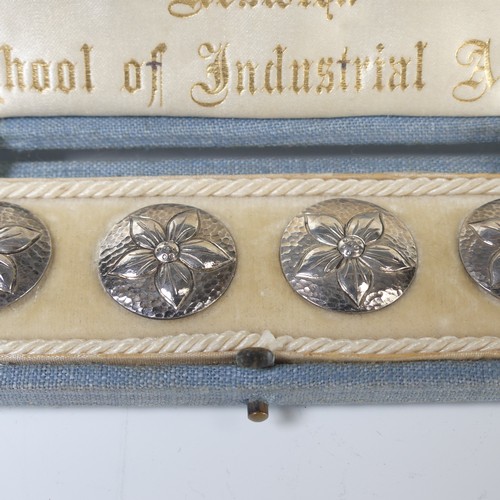 38 - A set of six Arts & Crafts silver Buttons, each circular button cast in low relief with a flower... 