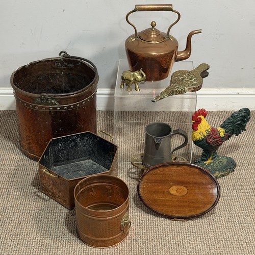A 19th century copper studded Bucket, with wrought iron handle, H 33 cm, together with a Victorian brass Kettle, hexagonal copper Pot, painted cast iron Doorstop in the form of a rooster, Georgian style Bucket with lion head swing handles, small Bellows depicting a ship, Edwardian mahogany oval Tray with scalloped gallery and shell inlaid to the centre, etc. (10)