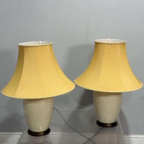 26 - A pair of modern crackle-glazed table Lamps, H 58 cm, together with three others, with wooden bases ... 