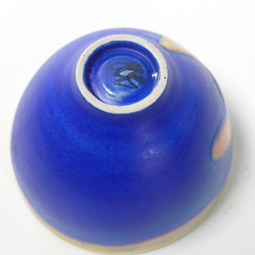 58 - A art glass green bowl/ashtray, possibly Whitefriars, 9cm high, D 13cm, together with a pale blue gl... 