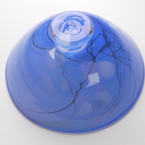 58 - A art glass green bowl/ashtray, possibly Whitefriars, 9cm high, D 13cm, together with a pale blue gl... 