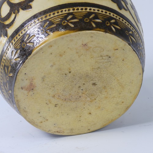 69 - A C. H. Brannam pottery Jardinière, dated 1852, decorated with scrolling foliage, incised 'C. H. Bra... 