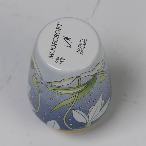 105 - A Moorcroft Pottery miniature ‘Snowdrop’ enamelled vase, dated 1998, decorated in printed coloured e... 