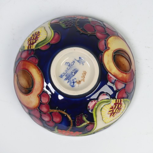 116 - A Moorcroft Pottery ‘Queen’s Choice’ pattern footed dish, by Emma Bossons, dated 2000, impressed mar... 